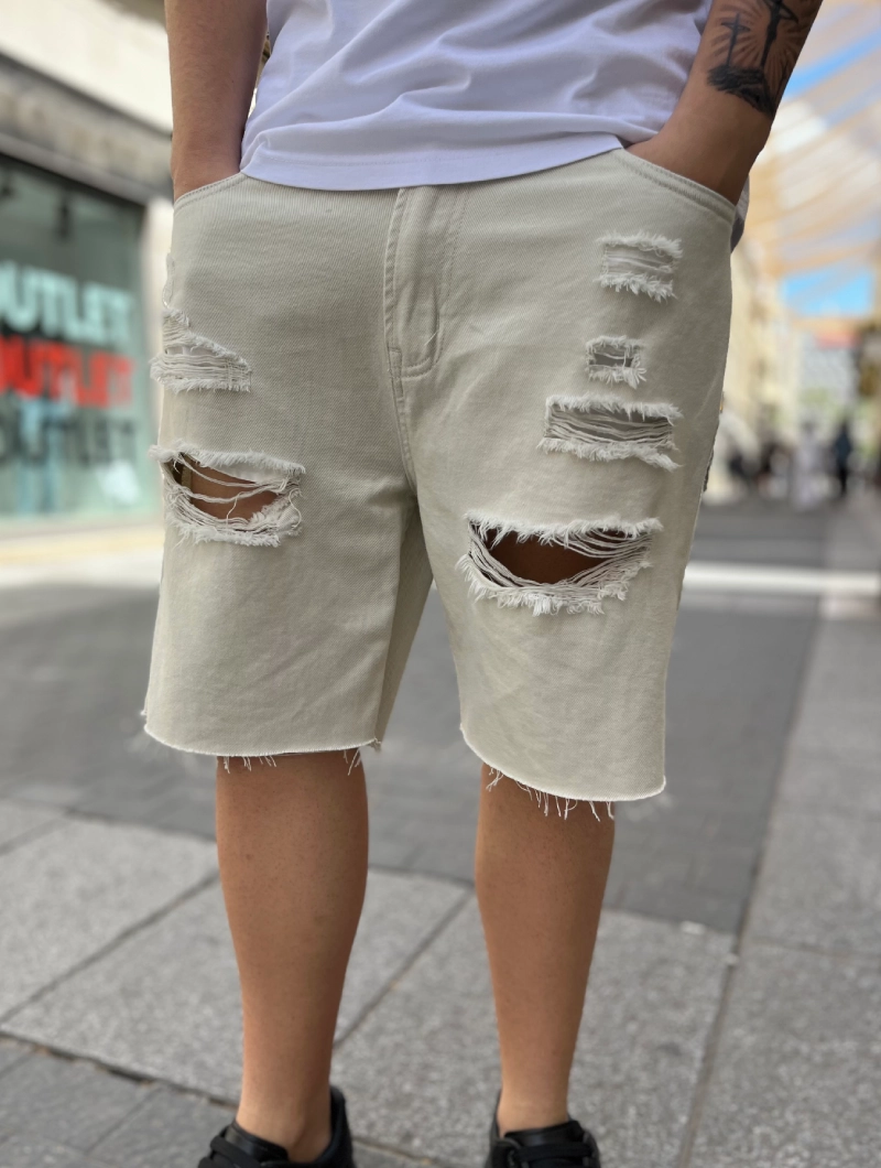 Bermuda vaquera beige rota